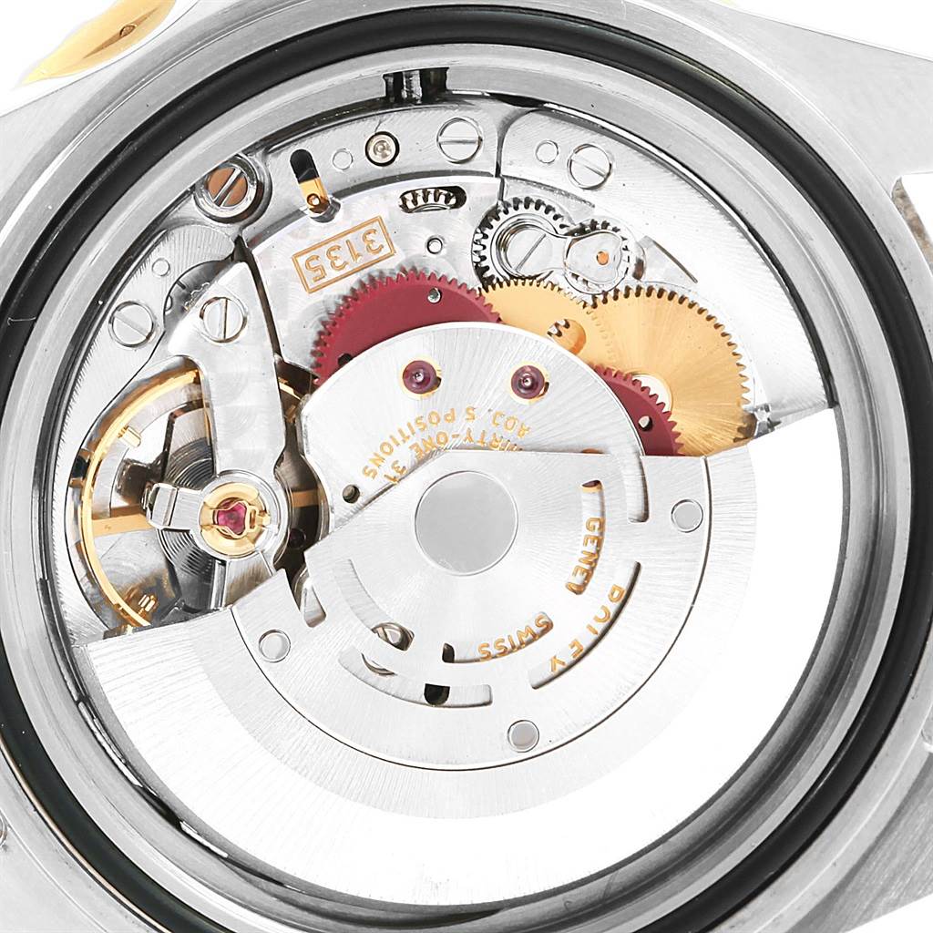 This image shows the intricate internal movement mechanism of the Rolex Submariner 16613 Men's Steel and Gold (two tone) Blue Dial 16613 Men's Steel and Gold (two tone) Blue Dial watch from a rear view.