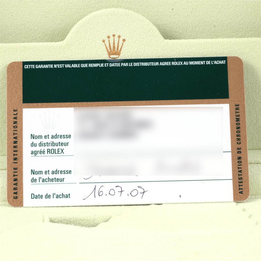 The image shows the international guarantee card for a Rolex Submariner 16613 Men's Steel and Gold (two tone) Blue Dial 16613 Men's Steel and Gold (two tone) Blue Dial watch, with blurred owner and distributor details.