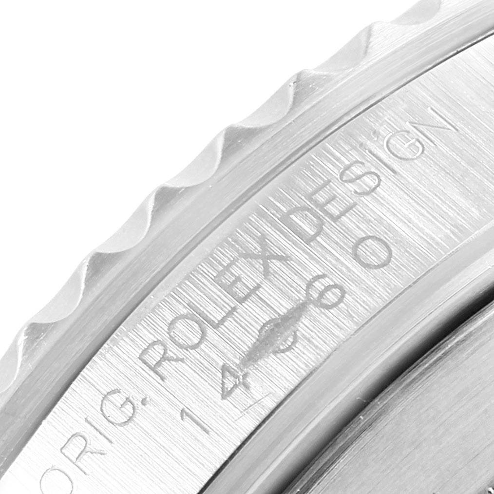 This is a close-up angle of the bezel and part of the case on a Rolex Submariner 14060 Men's Stainless Steel Black Dial 14060 Men's Stainless Steel Black Dial watch.