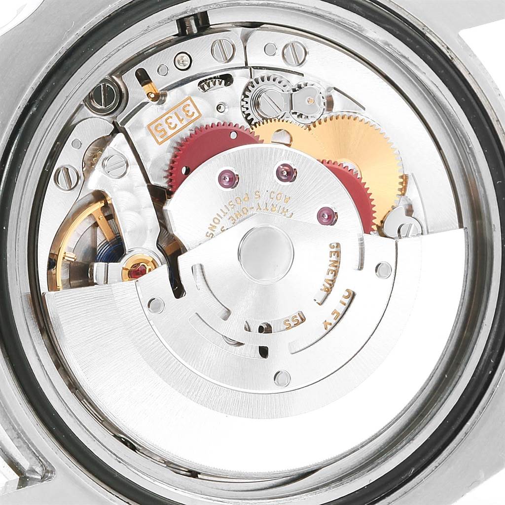 This image shows the inner mechanical movement of a Rolex Submariner 116610LV Men's Stainless Steel Green Dial 116610LV Men's Stainless Steel Green Dial watch viewed from the back.