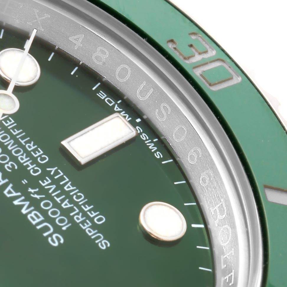 The macro shot of the Rolex Submariner 116610LV Men's Stainless Steel Green Dial 116610LV Men's Stainless Steel Green Dial watch shows the green bezel, part of the dial, and hour markers.