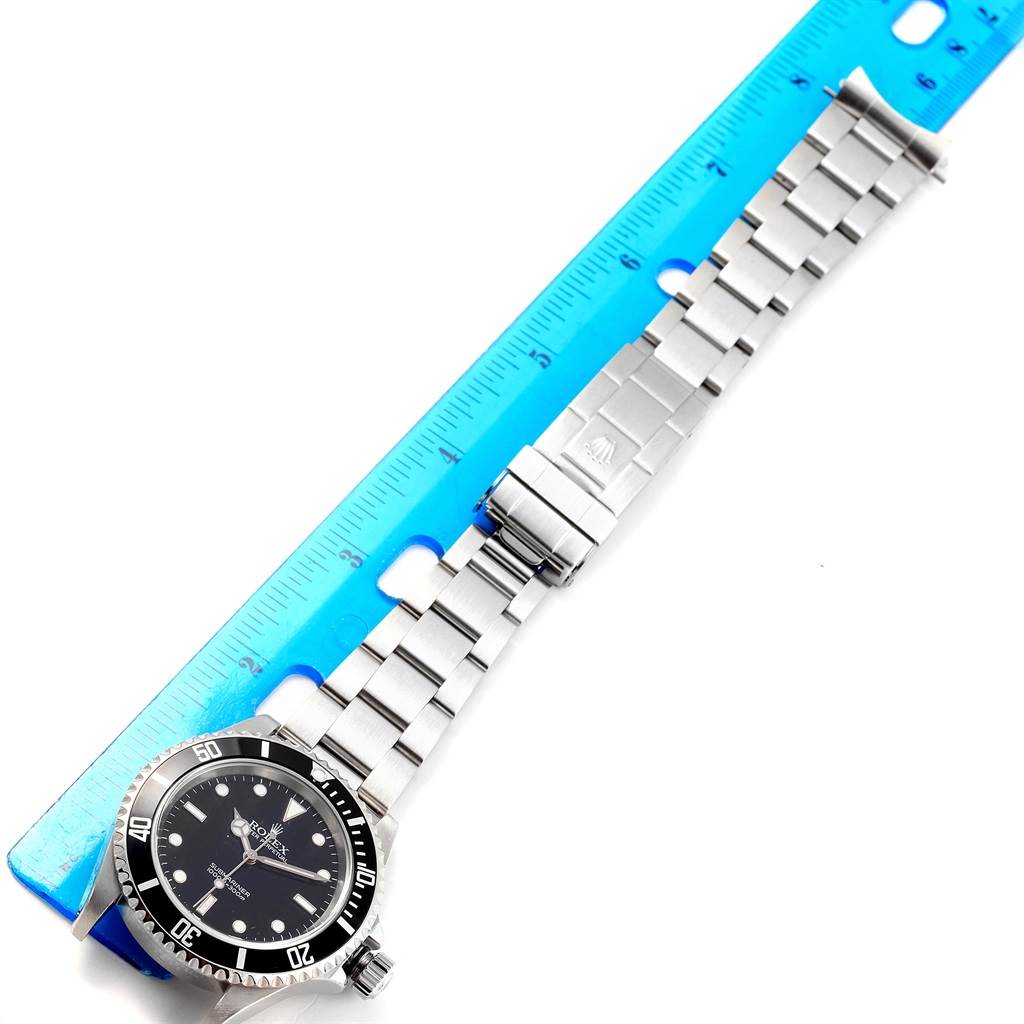 The image shows a top-down view of a Rolex Submariner 14060 Men's Stainless Steel Black Dial 14060 Men's Stainless Steel Black Dial watch, including its bezel, face, and bracelet measured against a ruler.