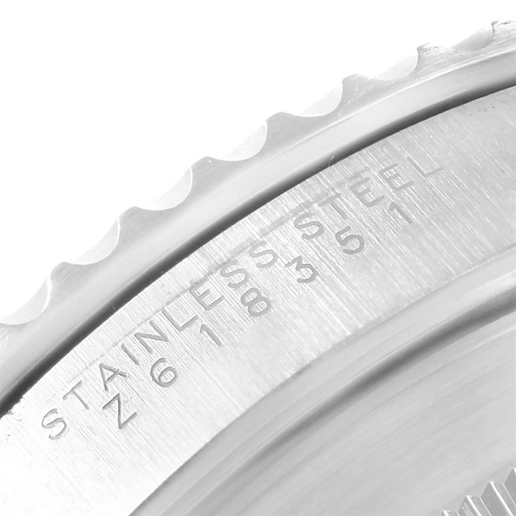 This close-up image shows the bezel and part of the case back of a Rolex Submariner 14060 Men's Stainless Steel Black Dial 14060 Men's Stainless Steel Black Dial watch.