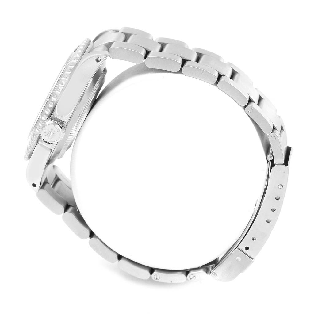 The image shows a side view of the Rolex Submariner 14060 Men's Stainless Steel Black Dial 14060 Men's Stainless Steel Black Dial watch, highlighting its stainless steel bracelet and crown.