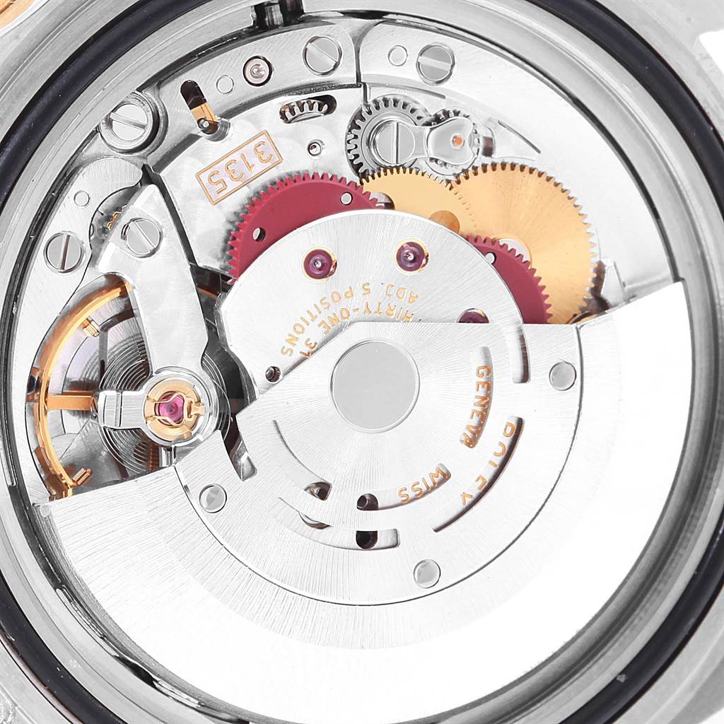 This close-up image shows the intricate internal mechanism of a Rolex Submariner 16613 Men's Steel and Gold (two tone) Champagne Dial 16613 Men's Steel and Gold (two tone) Champagne Dial watch.