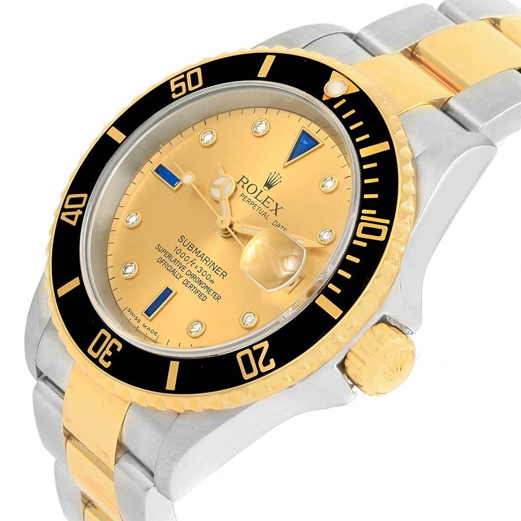 This Rolex Submariner 16613 Men's Steel and Gold (two tone) Champagne Dial 16613 Men's Steel and Gold (two tone) Champagne Dial watch is shown from a front-side angle, highlighting its gold dial, bezel, and two-tone bracelet.