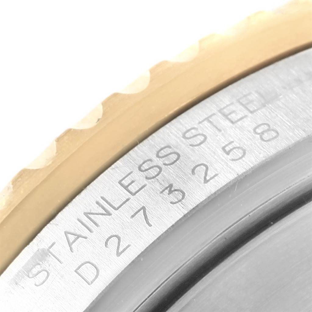 The image shows a close-up of the stainless steel case back and serial number of a Rolex Submariner 16613 Men's Steel and Gold (two tone) Champagne Dial 16613 Men's Steel and Gold (two tone) Champagne Dial watch.