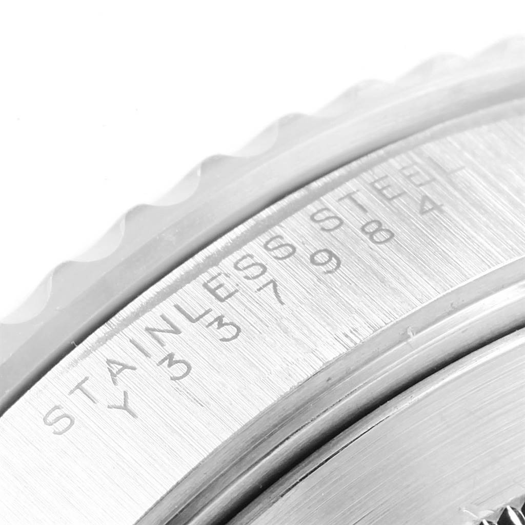 This is a close-up view of the edge and stainless steel engraving on a Rolex Submariner 14060 Men's Stainless Steel Black Dial 14060 Men's Stainless Steel Black Dial watch case.