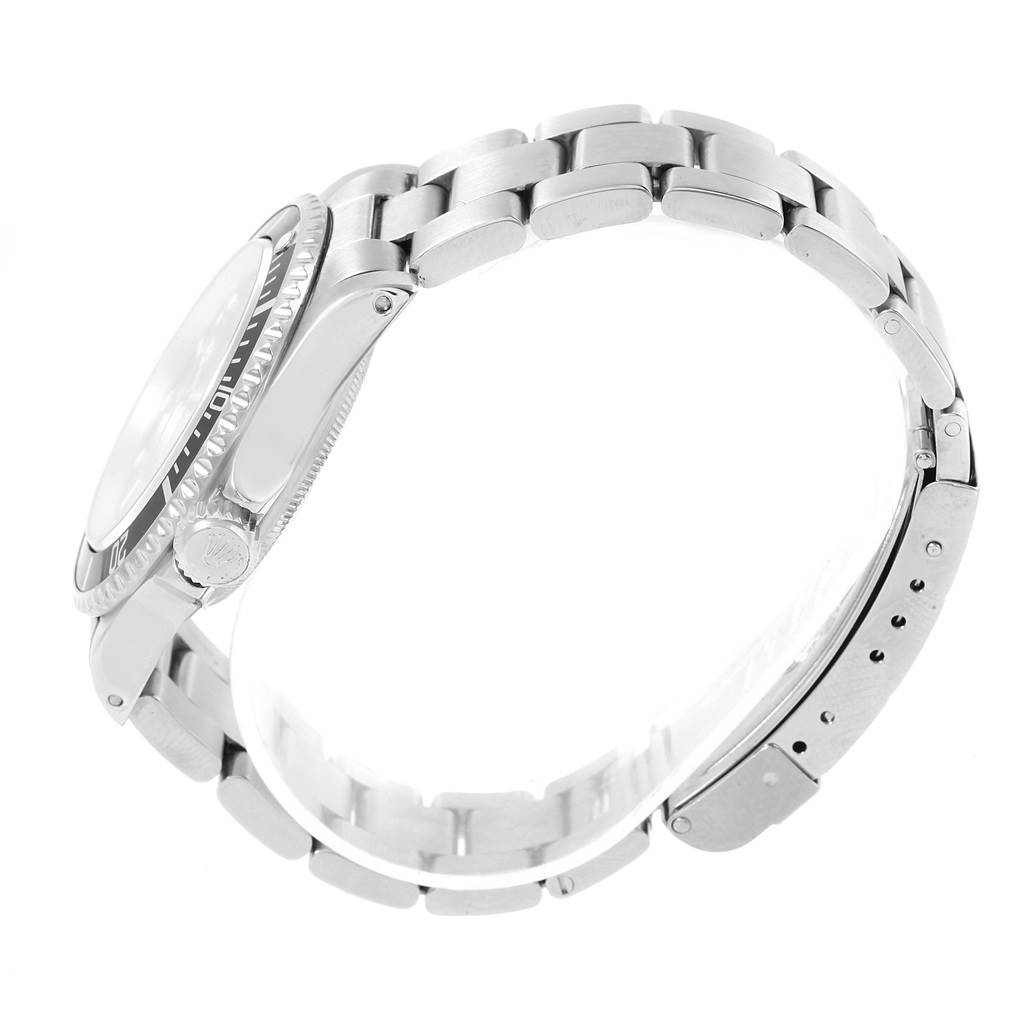 The image shows a side view of the Rolex Submariner 14060 Men's Stainless Steel Black Dial 14060 Men's Stainless Steel Black Dial watch, highlighting the bracelet, clasp, and crown.