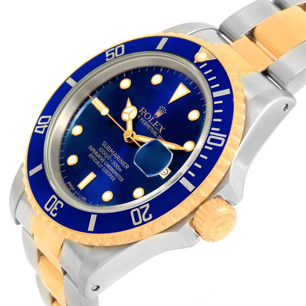 The image shows a close-up angle of a Rolex Submariner 16613 Men's Steel and Gold (two tone) Blue Dial 16613 Men's Steel and Gold (two tone) Blue Dial watch, showcasing its bezel, dial, hands, and part of the bracelet.