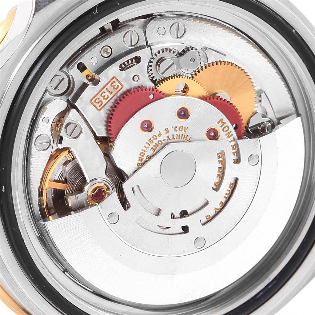 The image shows a close-up view of the movement and internal mechanism of a Rolex Submariner 16613 Men's Steel and Gold (two tone) Blue Dial 16613 Men's Steel and Gold (two tone) Blue Dial watch.