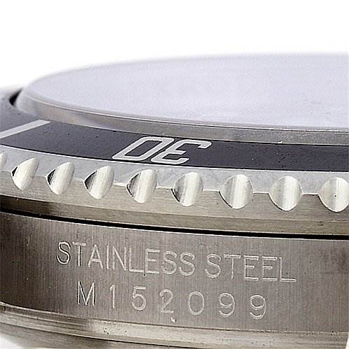 This close-up angle shows the bezel and case side with the serial engraving of the Rolex Submariner 16610 Men's Stainless Steel Black Dial 16610 Men's Stainless Steel Black Dial model.