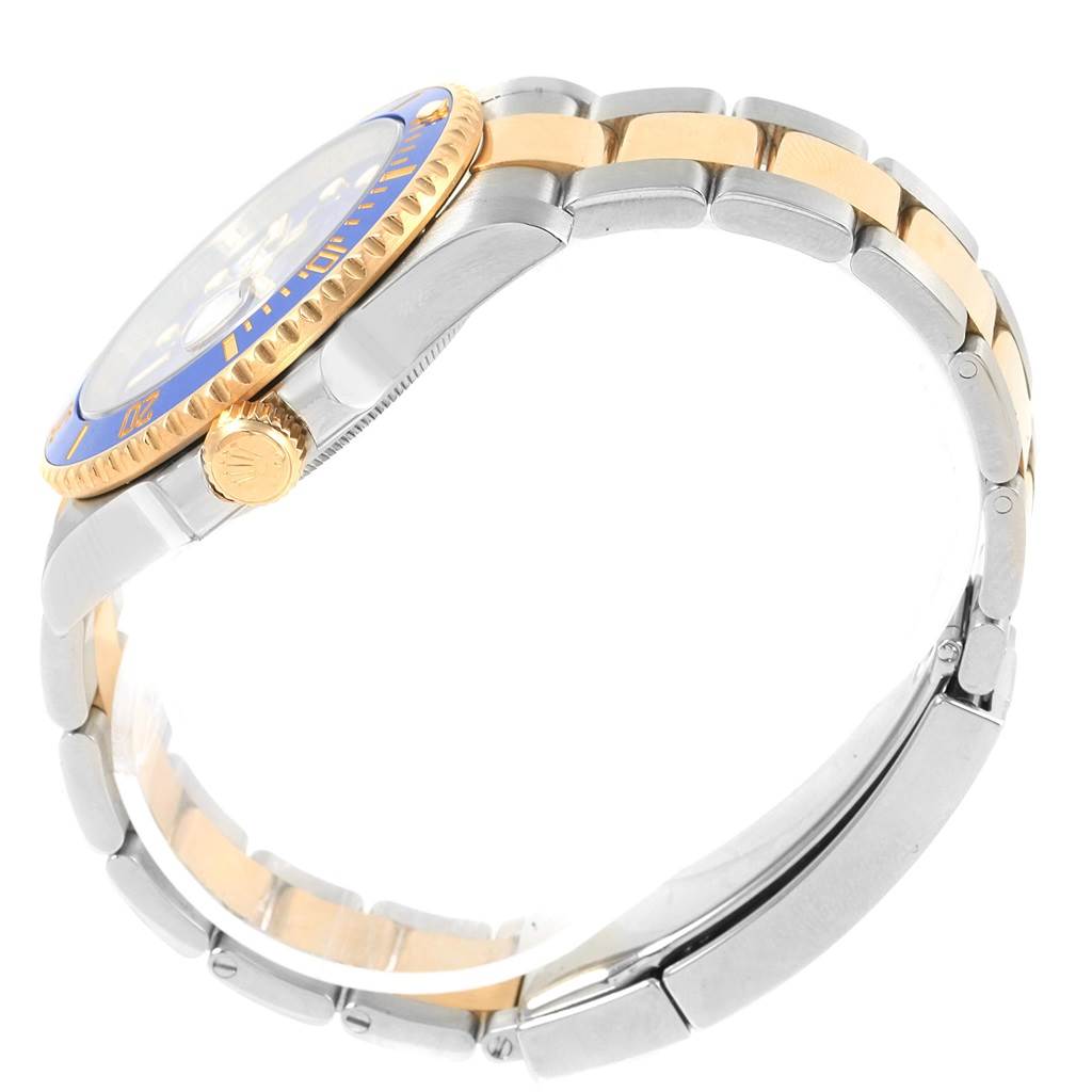 This side view angle of the Rolex Submariner 116613 Men's Steel and Gold (two tone) Blue Dial 116613 Men's Steel and Gold (two tone) Blue Dial showcases the bracelet, crown, and bezel.