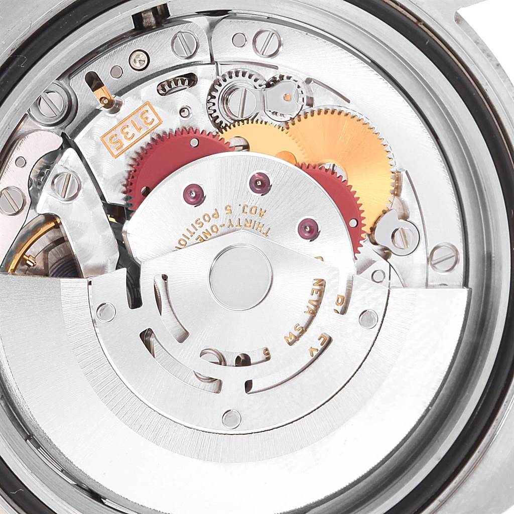 This image shows the intricate internal mechanism of a Rolex Submariner 116613 Men's Steel and Gold (two tone) Blue Dial 116613 Men's Steel and Gold (two tone) Blue Dial watch viewed from the back.