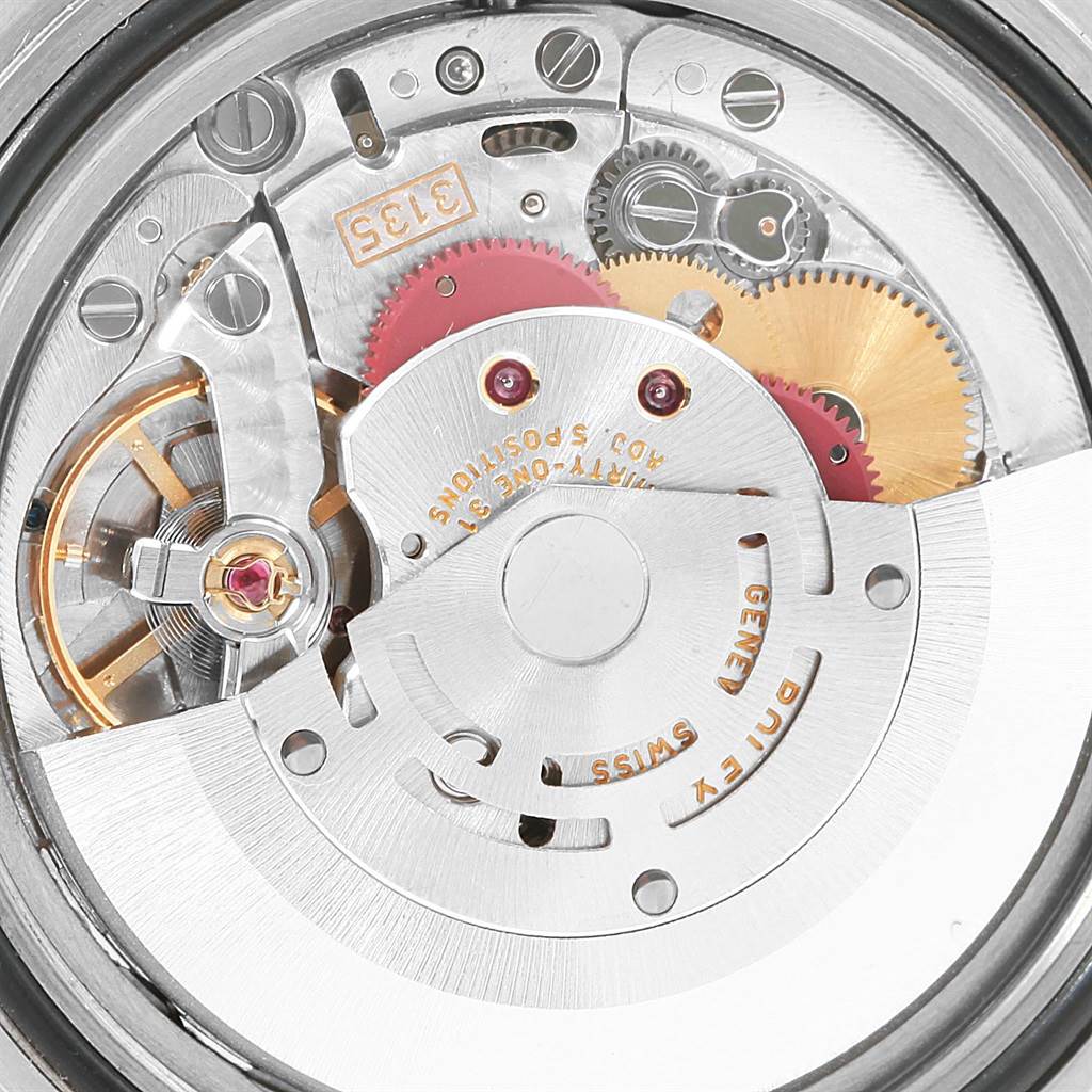 This image shows a close-up view of the movement mechanism inside a Rolex Submariner 16610 Men's Stainless Steel Black Dial 16610 Men's Stainless Steel Black Dial watch.