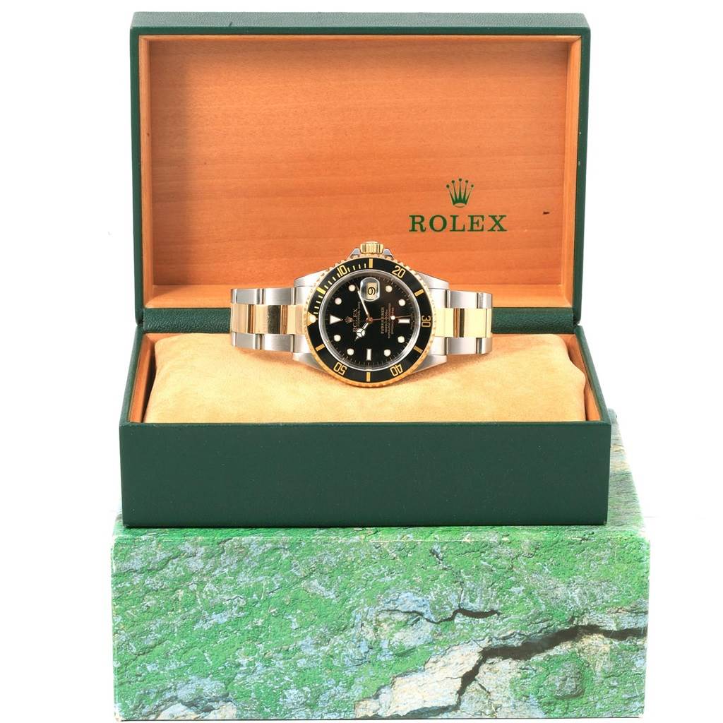 The Rolex Submariner 16613 Men's Steel and Gold (two tone) Black Dial 16613 Men's Steel and Gold (two tone) Black Dial watch is displayed front-forward in its branded open box.