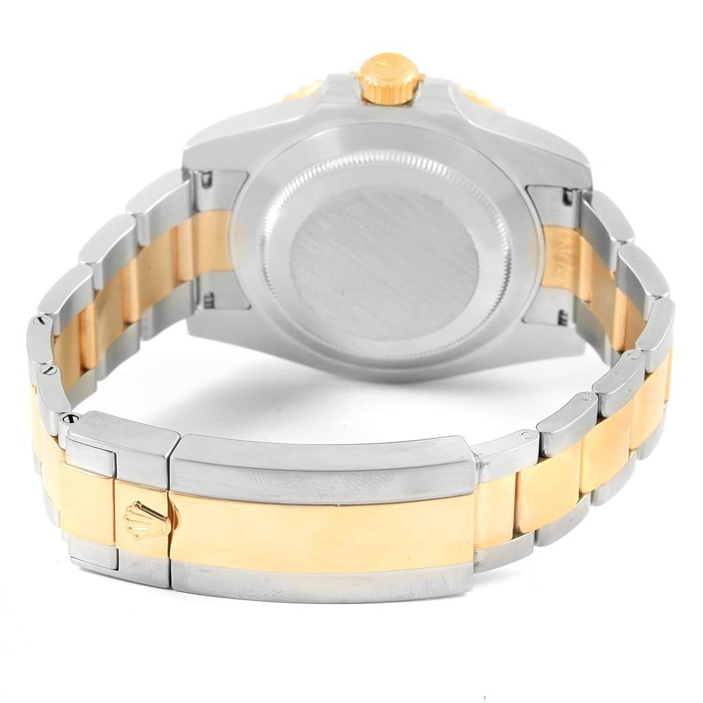 This image shows the back of the Rolex Submariner 116613 Men's Steel and Gold (two tone) Black Dial 116613 Men's Steel and Gold (two tone) Black Dial watch, focusing on the case back and part of the bracelet.