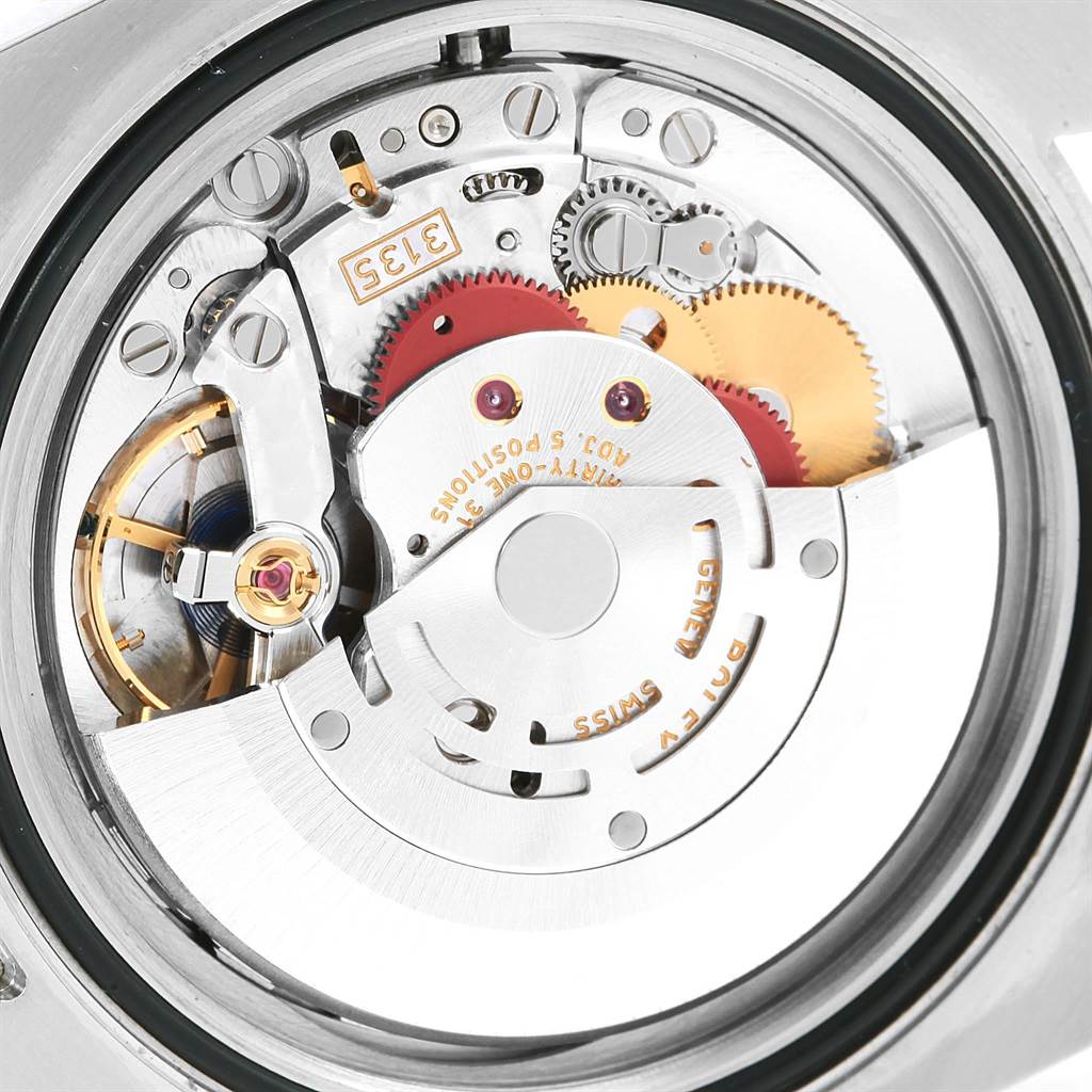 This image shows the internal mechanism of a Rolex Submariner 116613 Men's Steel and Gold (two tone) Black Dial 116613 Men's Steel and Gold (two tone) Black Dial watch, focusing on the intricate gears and components.