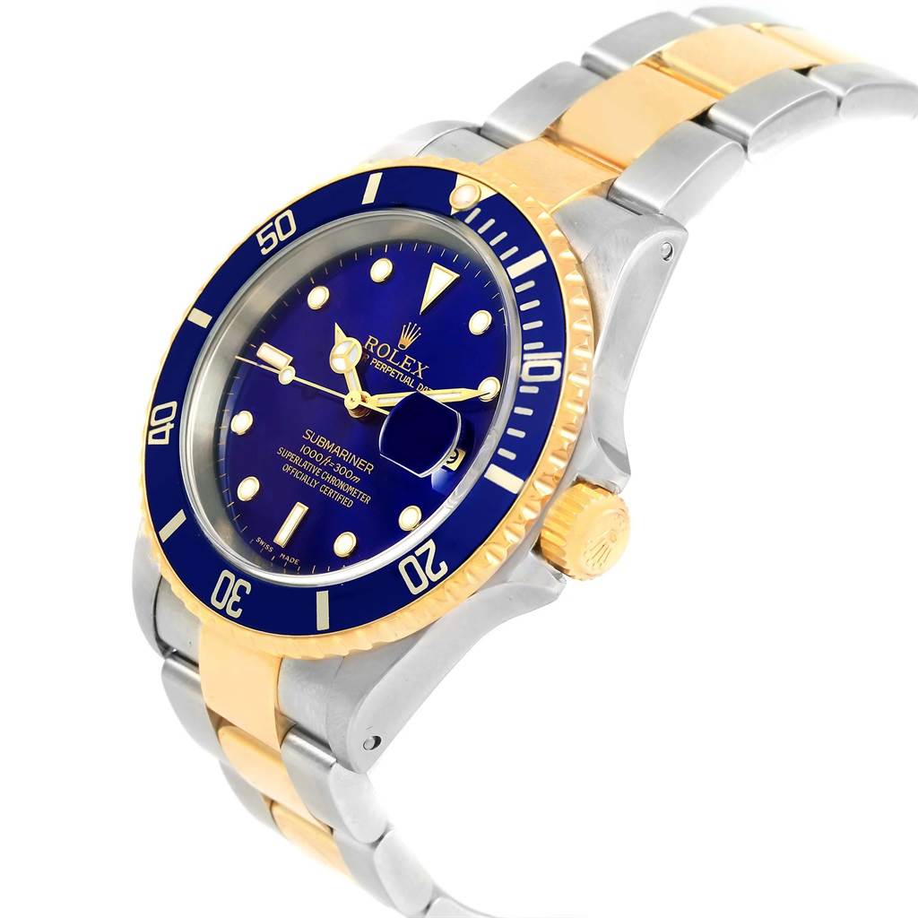 The image shows a side angle of a Rolex Submariner 16613 Steel and Gold (two tone) Blue Dial 16613 Steel and Gold (two tone) Blue Dial watch highlighting its blue dial, gold bezel, and two-tone bracelet.