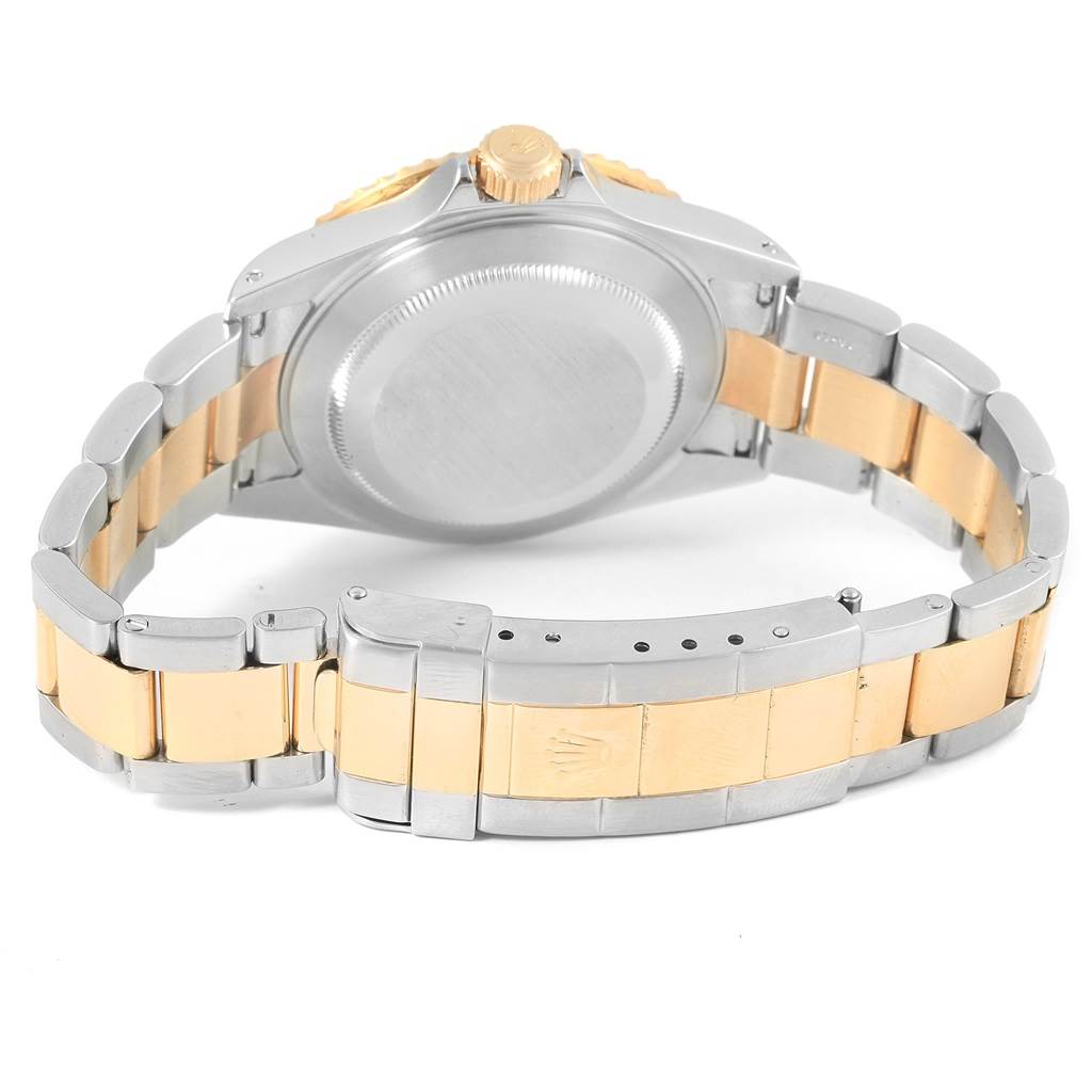 The image shows the back case and bracelet of a Rolex Submariner 16613 Steel and Gold (two tone) Blue Dial 16613 Steel and Gold (two tone) Blue Dial watch from a rear angle.