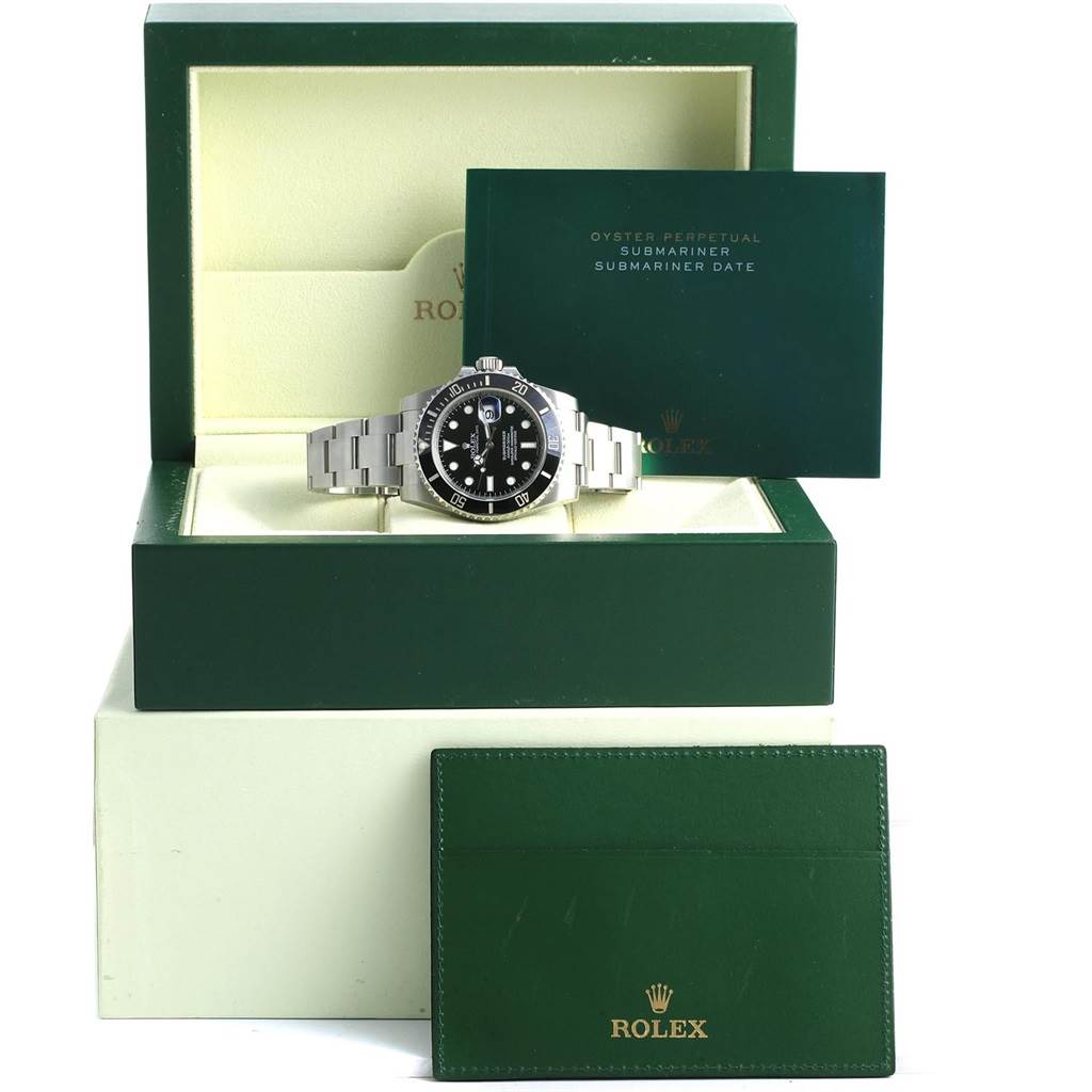 The image displays a Rolex Submariner 116610 Men's Stainless Steel Black Dial 116610 Men's Stainless Steel Black Dial watch from a front angle, along with its box, warranty card, and booklet.