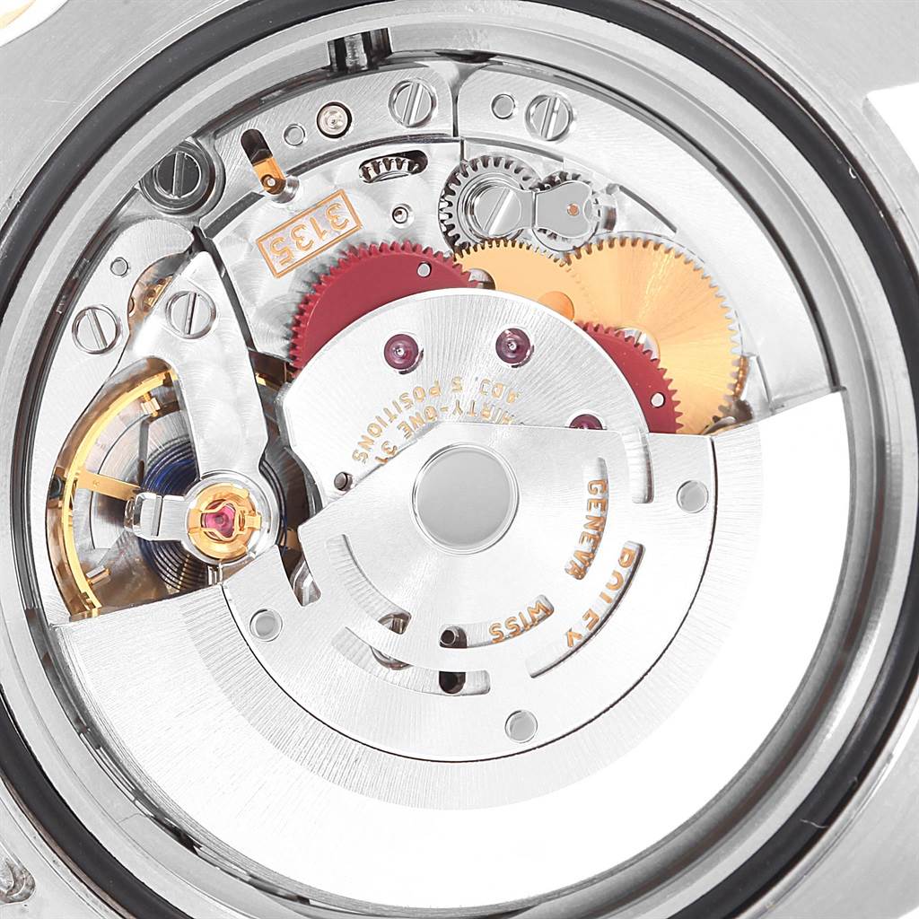 This image shows the internal movement components of a Rolex Submariner 116613 Men's Steel and Gold (two tone) Blue Dial 116613 Men's Steel and Gold (two tone) Blue Dial watch from a close-up, rear angle.