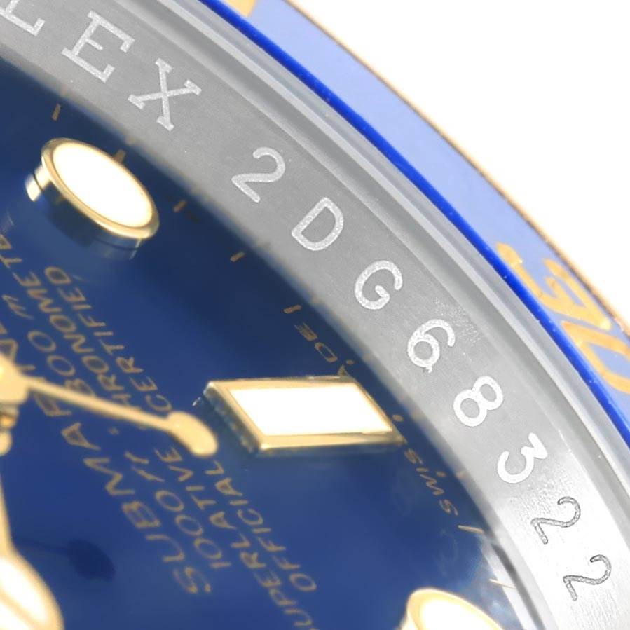 This image shows a close-up angle focusing on the dial and engraved bezel of a Rolex Submariner 116613 Men's Steel and Gold (two tone) Blue Dial 116613 Men's Steel and Gold (two tone) Blue Dial watch.