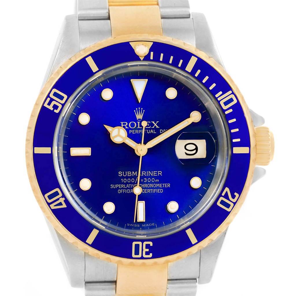The image shows a frontal view of a Rolex Submariner 16613 Men's Steel and Gold (two tone) Blue Dial 16613 Men's Steel and Gold (two tone) Blue Dial watch, featuring a blue dial, gold accents, and stainless steel and gold bracelet.