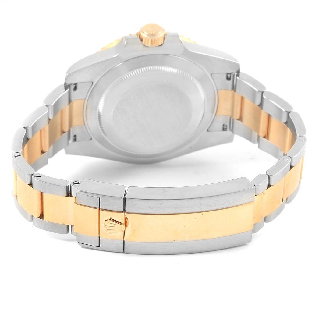 The image shows the back view of a Rolex Submariner 116613 Men's Steel and Gold (two tone) Black Dial 116613 Men's Steel and Gold (two tone) Black Dial watch, focusing on the case back and two-tone bracelet with the clasp visible.