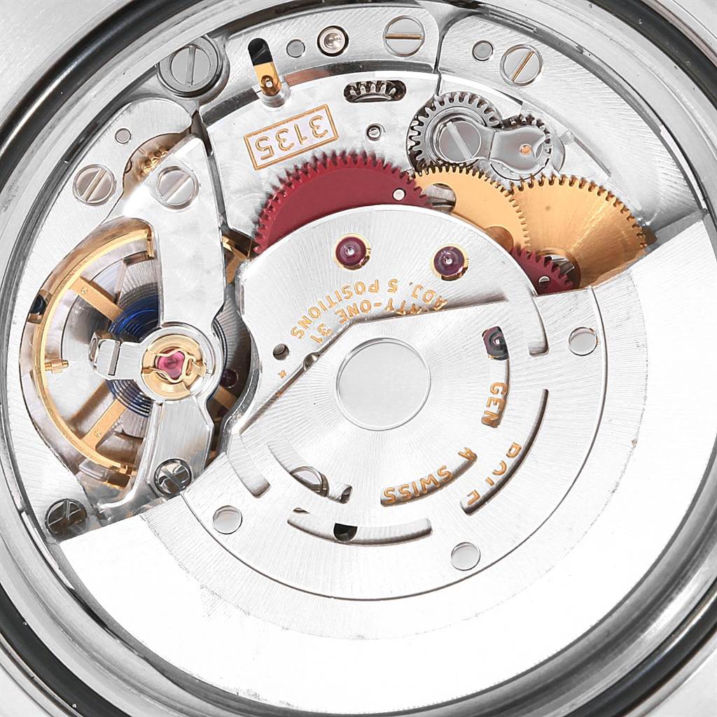 The image shows a close-up view of the movement parts inside a Rolex Submariner 116613 Men's Steel and Gold (two tone) Black Dial 116613 Men's Steel and Gold (two tone) Black Dial watch.