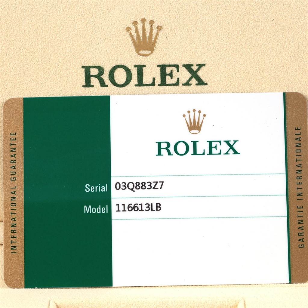 The image shows an international guarantee card for a Rolex Submariner 116613 Men's Steel and Gold (two tone) Blue Dial 116613 Men's Steel and Gold (two tone) Blue Dial model 116613LB.