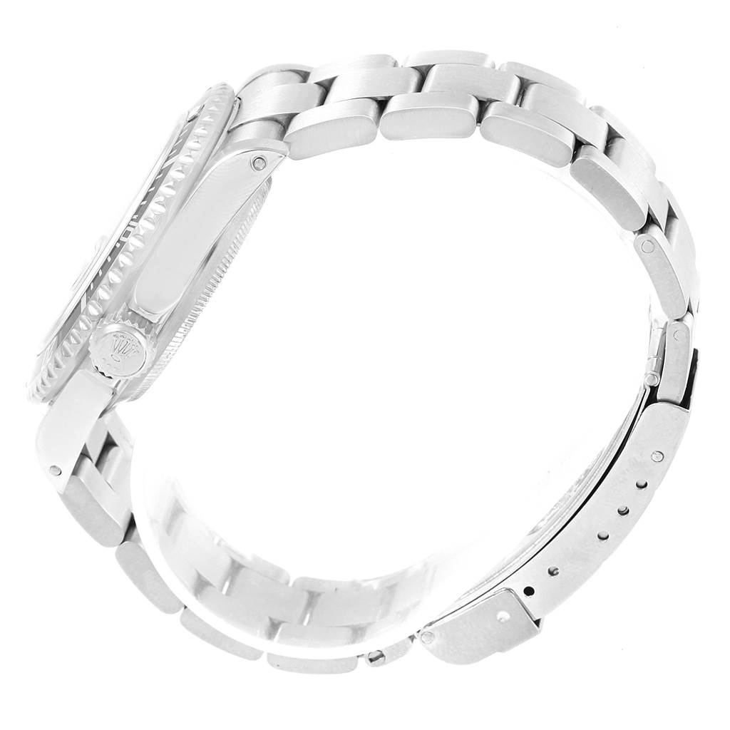 The image shows a side view of a Rolex Submariner 16610 Men's Stainless Steel Black Dial 16610 Men's Stainless Steel Black Dial, highlighting its case, crown, bracelet, and clasp.