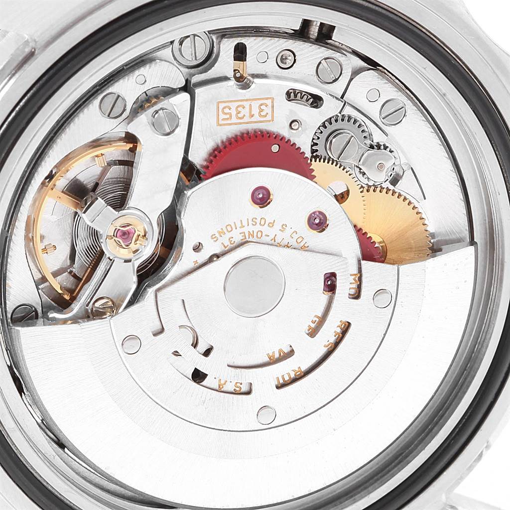 This image shows a detailed view of the Rolex Submariner 16610 Men's Stainless Steel Black Dial 16610 Men's Stainless Steel Black Dial model's movement and internal mechanics, focusing on the rotor and gears.