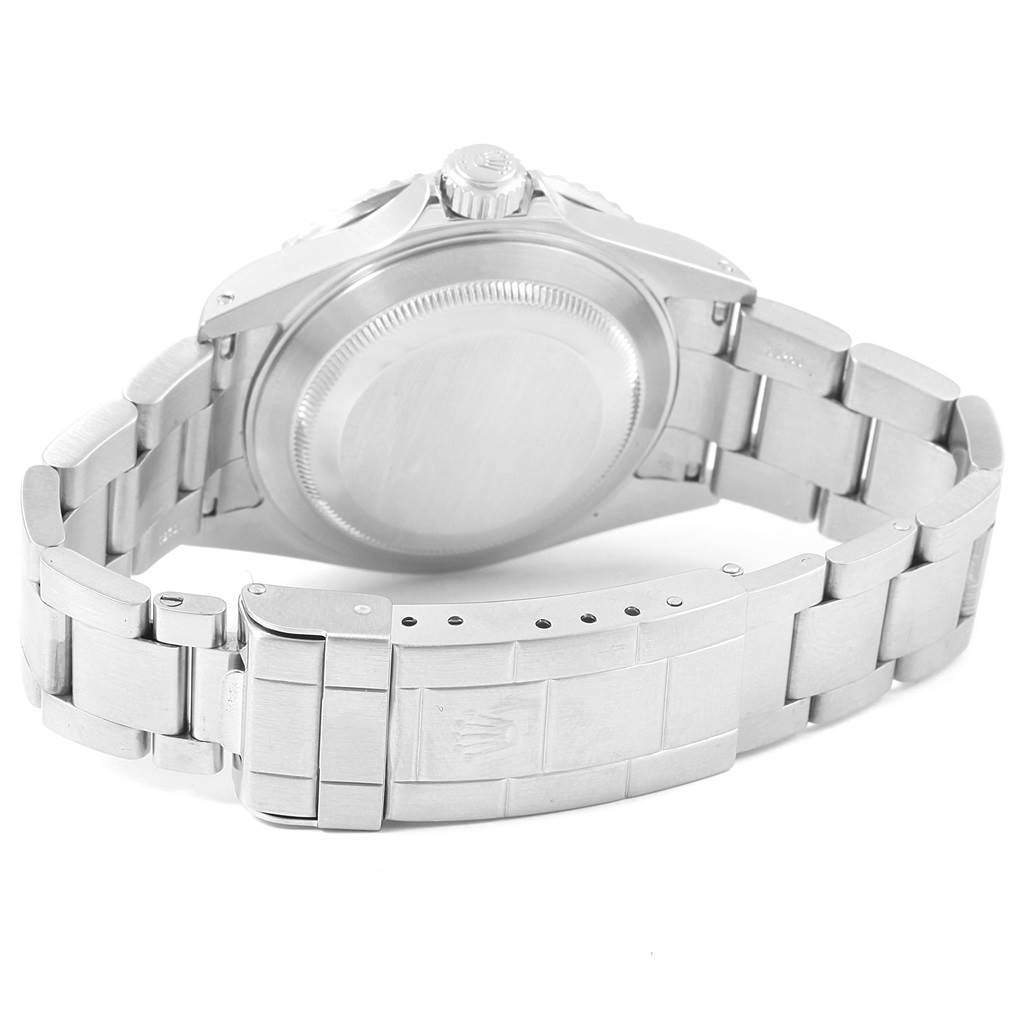 The image shows the back view of a Rolex Submariner 16610 Men's Stainless Steel Black Dial 16610 Men's Stainless Steel Black Dial watch, highlighting its case back and clasp with the bracelet.