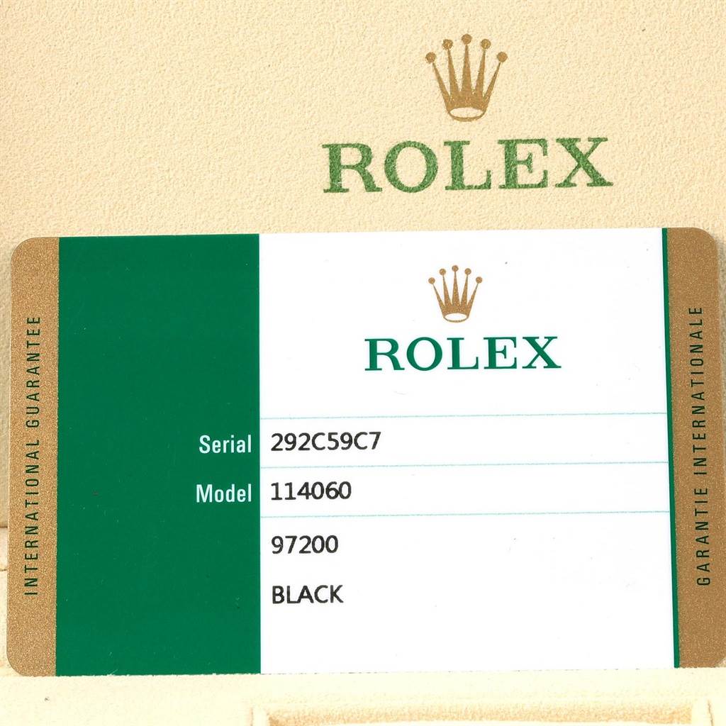 The image shows the guarantee card for a Rolex Submariner 114060 Men's Stainless Steel Black Dial 114060 Men's Stainless Steel Black Dial model 114060.