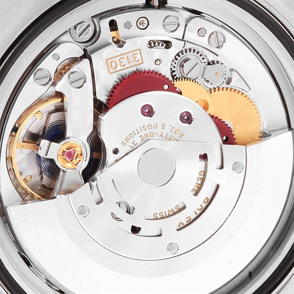 The image shows a close-up of the mechanical movement inside a Rolex Submariner 114060 Men's Stainless Steel Black Dial 114060 Men's Stainless Steel Black Dial watch, highlighting gears and intricate components.