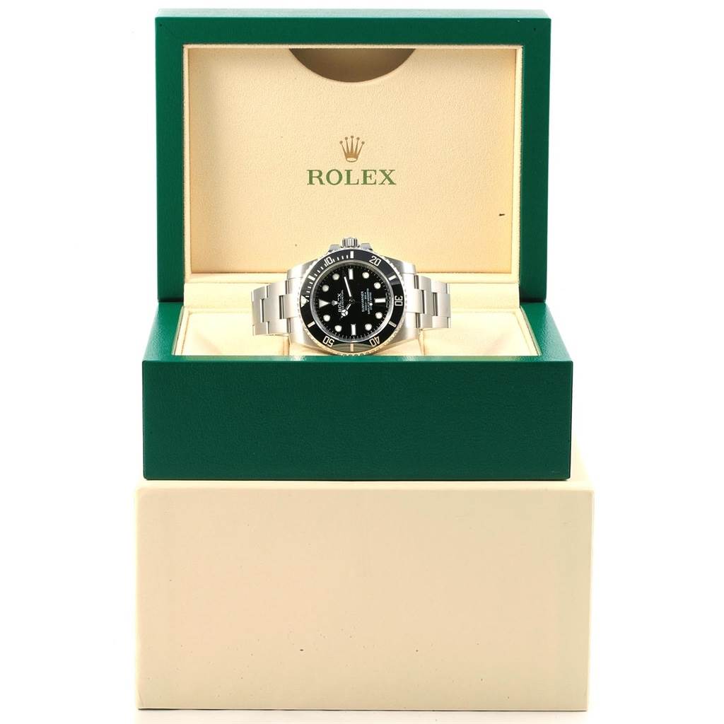 The image shows a Rolex Submariner 114060 Men's Stainless Steel Black Dial 114060 Men's Stainless Steel Black Dial watch from a front angle, displayed in an open green Rolex box.