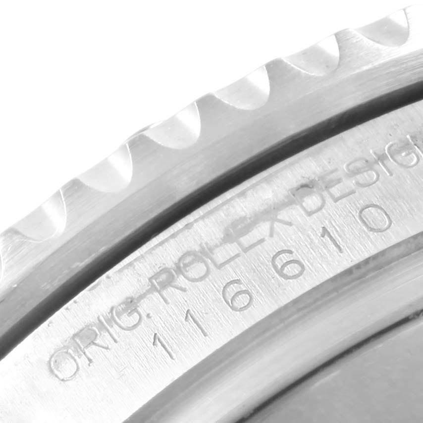 This close-up image shows the engraved case back of a Rolex Submariner 116610 Men
s Stainless Steel Black Dial 116610 Men
s Stainless Steel Black Dial watch.