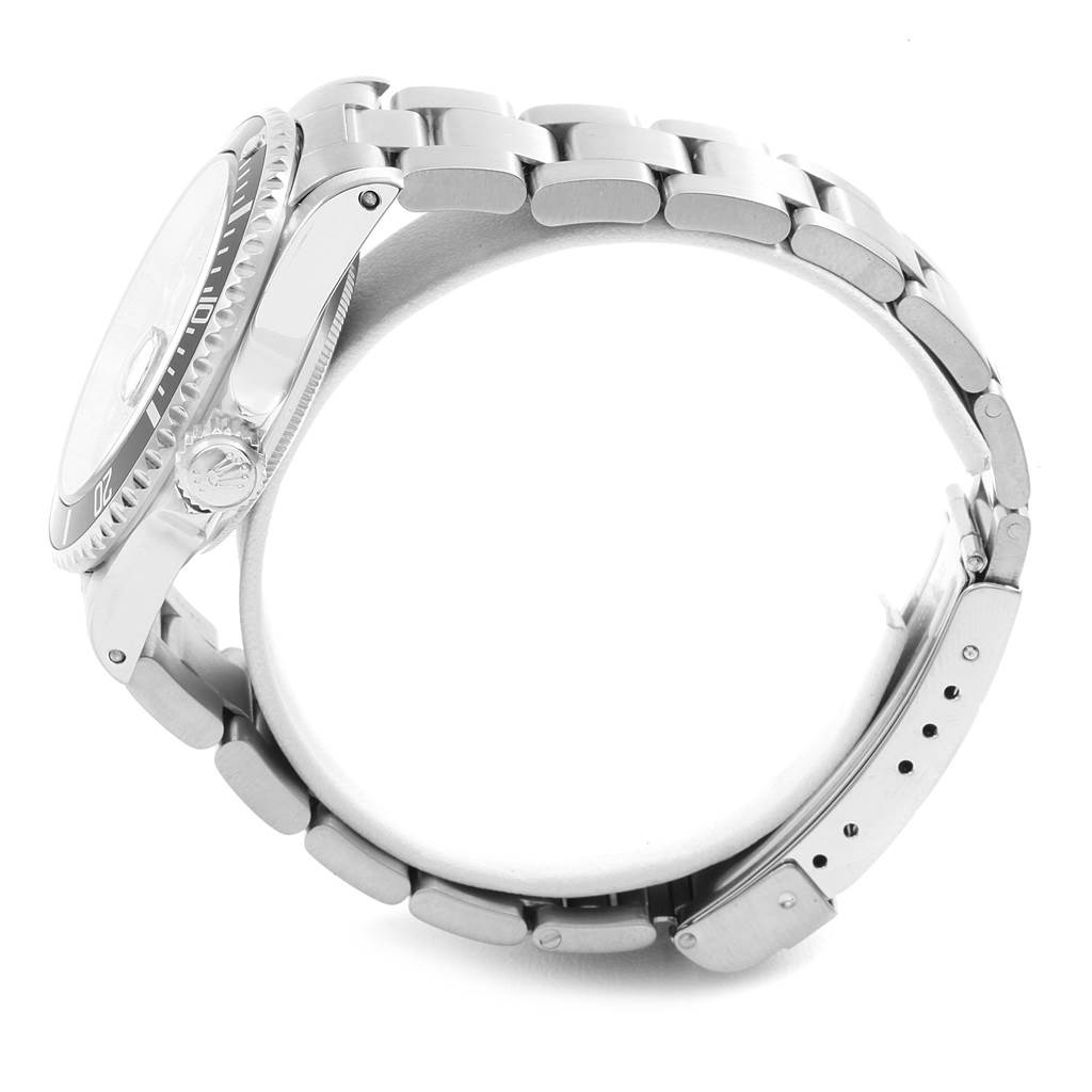 The Rolex Submariner 16610 Men
s Stainless Steel Black Dial 16610 Men
s Stainless Steel Black Dial watch is shown from a side angle, highlighting its bezel, crown, and metal bracelet.