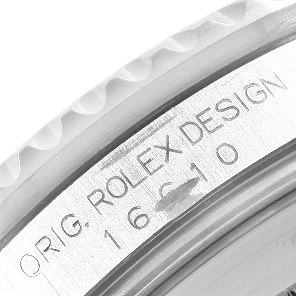 Close-up angle showing the engraved Rolex Submariner 16610 Men
s Stainless Steel Black Dial 16610 Men
s Stainless Steel Black Dial model "ORIG. ROLEX DESIGN 16610" on the inner bezel.