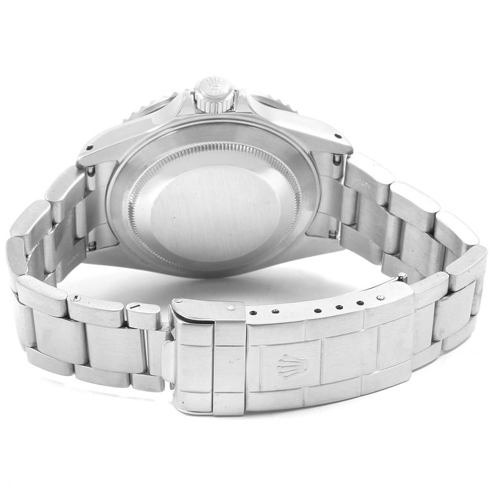 This image shows the back view of a Rolex Submariner 16610 Men
s Stainless Steel Black Dial 16610 Men
s Stainless Steel Black Dial watch, highlighting the case back and part of the bracelet with the clasp.