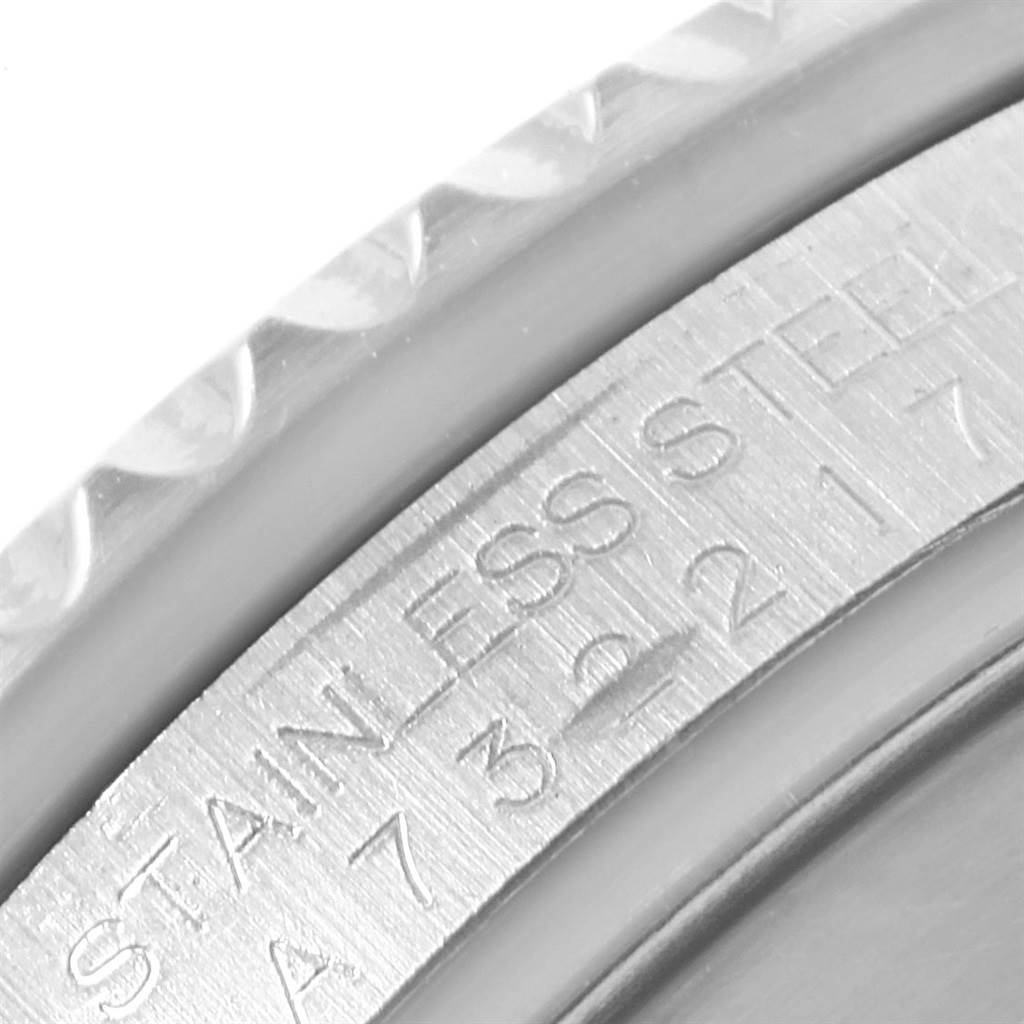 Close-up shot of the edge and inner bezel of a Rolex Submariner 16610 Men
s Stainless Steel Black Dial 16610 Men
s Stainless Steel Black Dial watch, showing 
STAINLESS STEEL
 engraving.