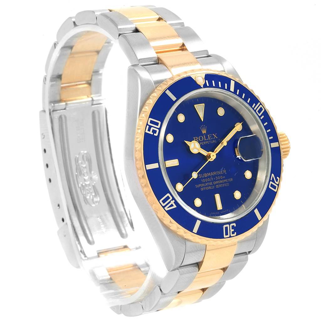 The image shows a Rolex Submariner 16613 Men
s Steel and Gold (two tone) Blue Dial 16613 Men
s Steel and Gold (two tone) Blue Dial watch at a left-side view angle, highlighting its blue dial, bezel, and two-tone bracelet.