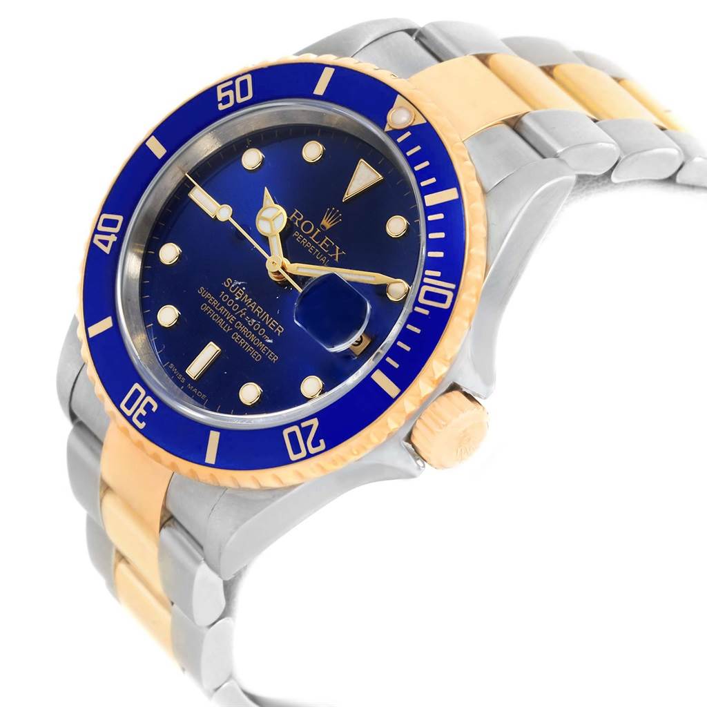 The image shows a three-quarter angle view of a Rolex Submariner 16613 Men
s Steel and Gold (two tone) Blue Dial 16613 Men
s Steel and Gold (two tone) Blue Dial watch, highlighting the bezel, dial, and bracelet.