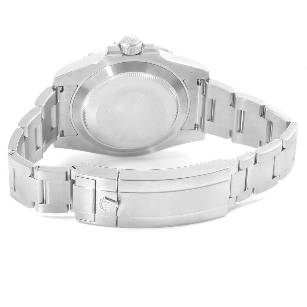 The image shows the back side of a Rolex Submariner 114060 Men
s Stainless Steel Black Dial 114060 Men
s Stainless Steel Black Dial watch focusing on the case back and bracelet with the clasp.