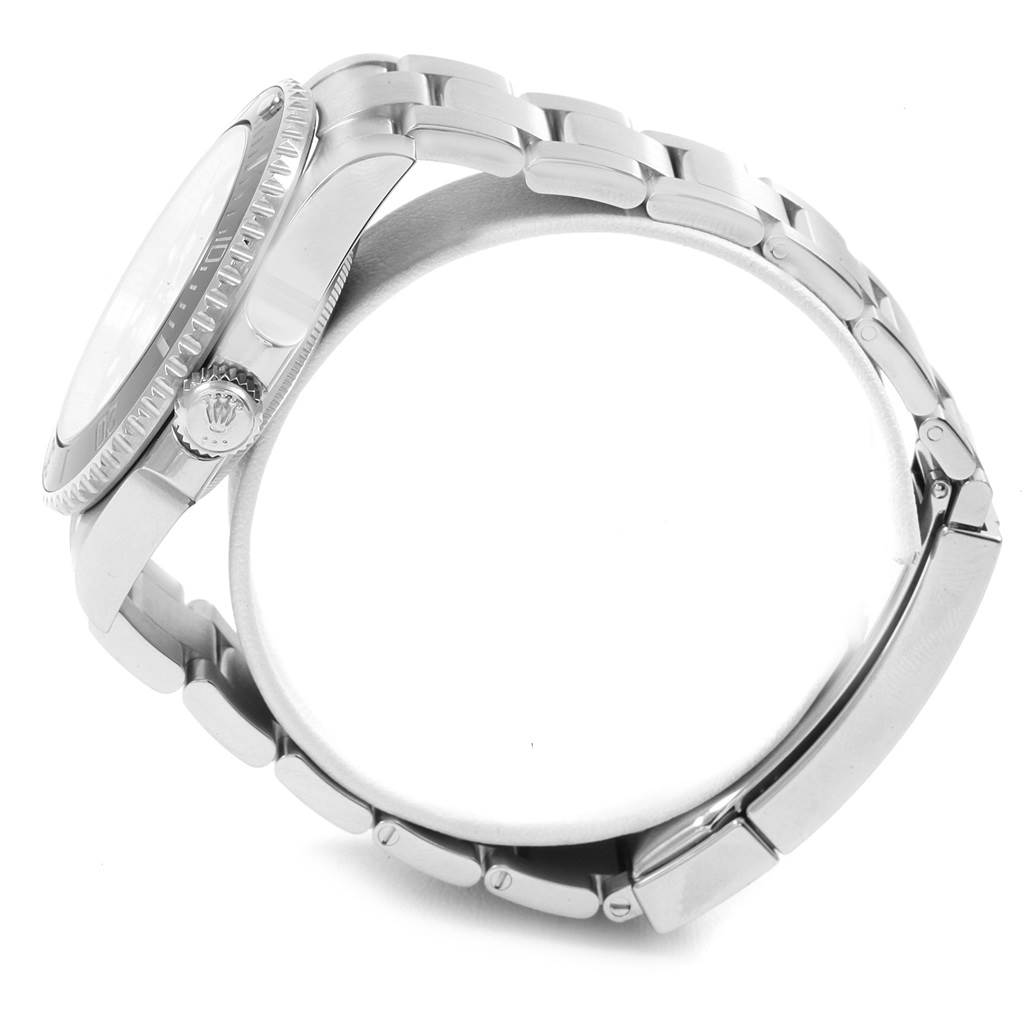 The image shows a side view of a Rolex Submariner 114060 Men
s Stainless Steel Black Dial 114060 Men
s Stainless Steel Black Dial watch, highlighting its crown, bezel, case, and part of the bracelet.