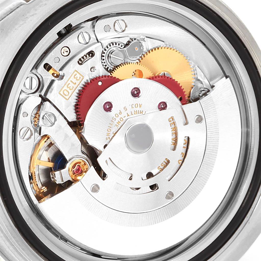 The image shows the internal mechanism and movement of a Rolex Submariner 114060 Men
s Stainless Steel Black Dial 114060 Men
s Stainless Steel Black Dial watch from a close-up, rear angle.