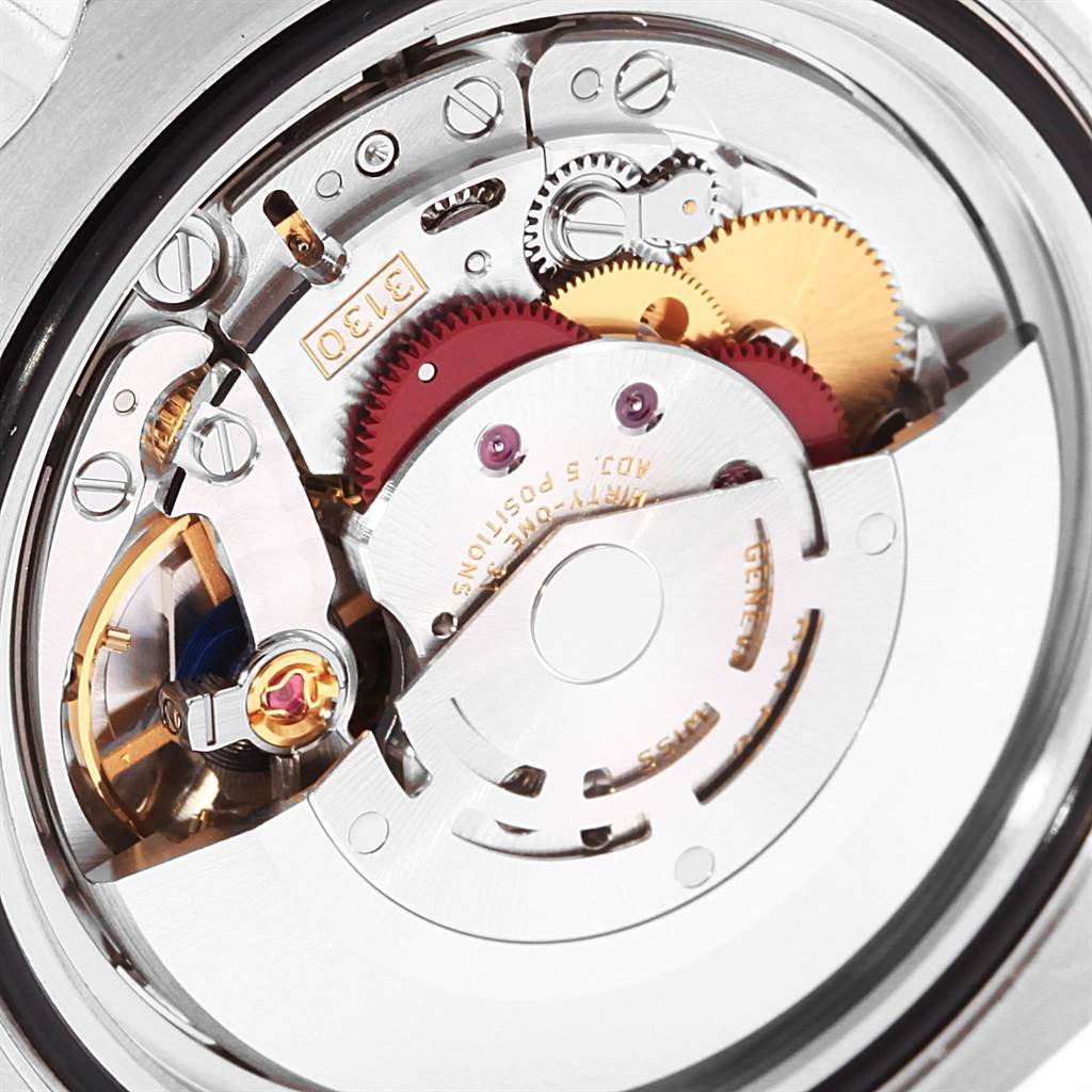 The image shows a close-up of the inner mechanical movement of a Rolex Submariner 114060 Men
s Stainless Steel Black Dial 114060 Men
s Stainless Steel Black Dial watch, highlighting the gears and components.