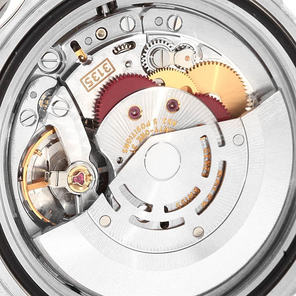 This image shows a close-up view of the intricate movement mechanism inside a Rolex Submariner 16610 Men
s Stainless Steel Black Dial 16610 Men
s Stainless Steel Black Dial watch.