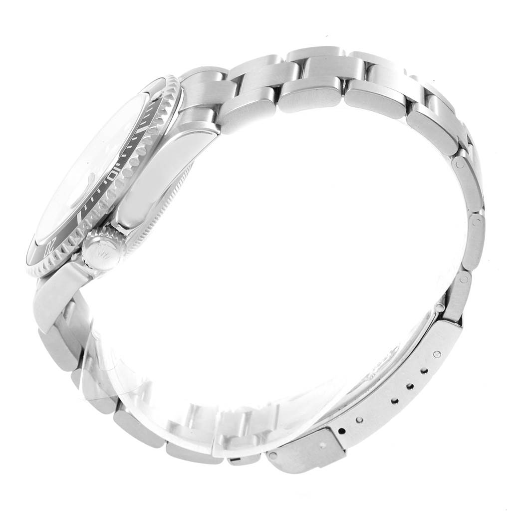 The image shows a side view of a Rolex Submariner 16610 Men
s Stainless Steel Black Dial 16610 Men
s Stainless Steel Black Dial watch focusing on its stainless steel bracelet and crown.